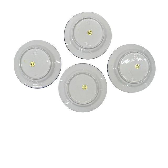 Set of four vintage Bassano floral pattern decorative plates. Hand painted in colors of pink, blue, purple, yellow and...