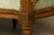 A late 18th-century French Louis XVI carved walnut settee, sourced in Loire Valley, France. Crafted in solid walnut, the...