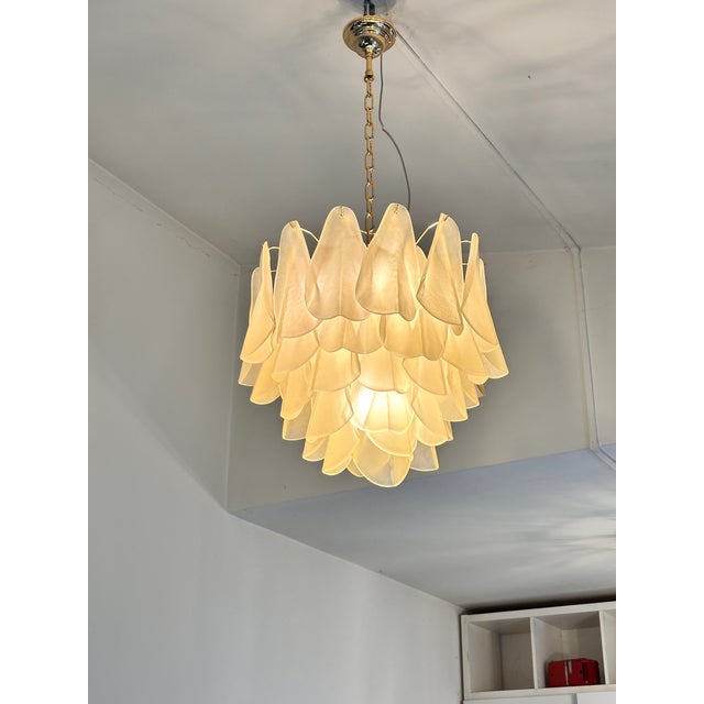 Contemporary and luxury Murano glass chandelier. “Rondini” traditional elements in Murano glass poured over a mold from a...