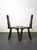 Pair of French Brutalist-style chairs. Robust design in solid wood with carved legs. Highly sculptural rustic chairs. They...
