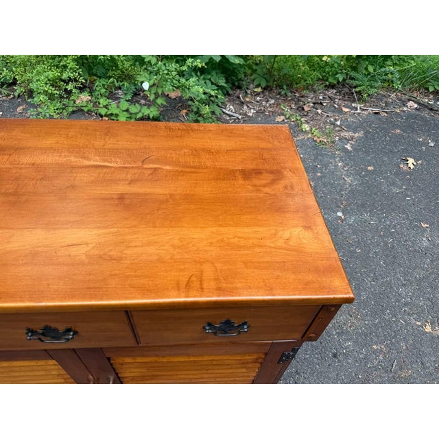 Vintage Early American Style Maple Buffet Server with Shutter Door Cabinet It features single dovetailed drawer, louvered...