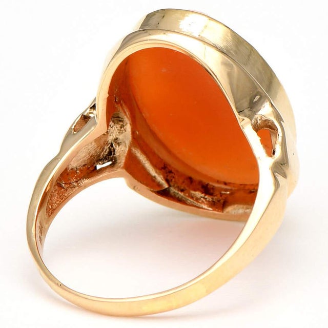 Delight your inner goddess with this charming, carved lady vintage cameo ring that features a large oval-shaped and coral-...