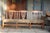 Purchased for our Craftsman bungalow in the early 2000s, this wooden bench with an upholstered cushioned seat has been a...