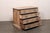 An Italian carved wood chest of four drawers from the 18th century. This antique chest from Italy has a rectangular-shaped...