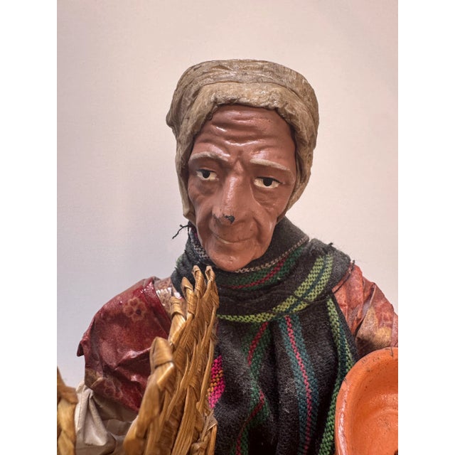 Charming pair of mid-century Mexican (or Guatemalan) folk art figurines depicting a farmer and his wife carrying pottery...