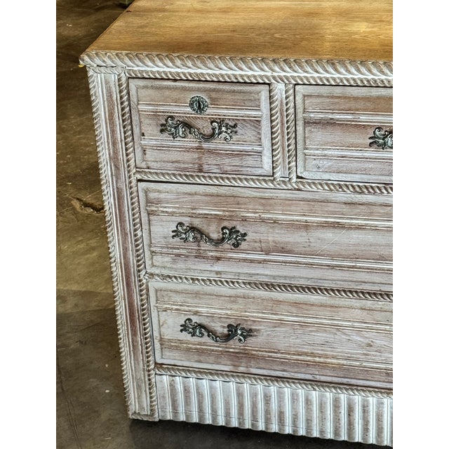 The Vintage French Whitewashed Oak Chest is a charming and practical piece of furniture for any bedroom. This rectangular...