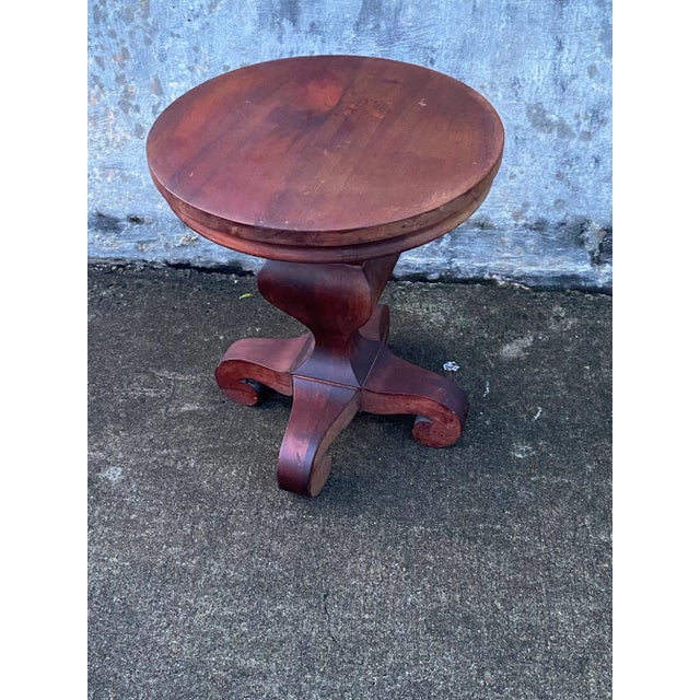 Lovely small wooden table. Sturdy does have some weight . A very fashionable stately base. Beautiful with master...