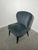 Elegant and compact cocktail chair by Dutchbone, featuring a beautifully curved shell back with decorative channel...