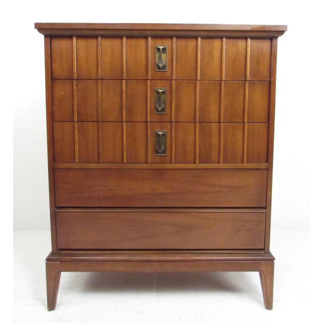 This stylish American walnut highboy dresser offers five spacious dovetailed drawers with sculpted fronts and unique brass...
