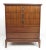 This stylish American walnut highboy dresser offers five spacious dovetailed drawers with sculpted fronts and unique brass...