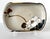 A glazed ceramic shallow bowl with surface paint decoration by Japanese imperial potter Makuzu Kozan ((1842–1916) with its...