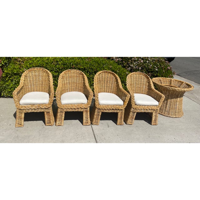 This gorgeous vintage set includes 4 blonde rattan wicker dining armchairs and a pedestal style dining table. It features...