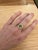 This beautiful ring features a 1.91 carat Peridot gemstone with natural earth mined diamonds in solid 14K yellow gold....