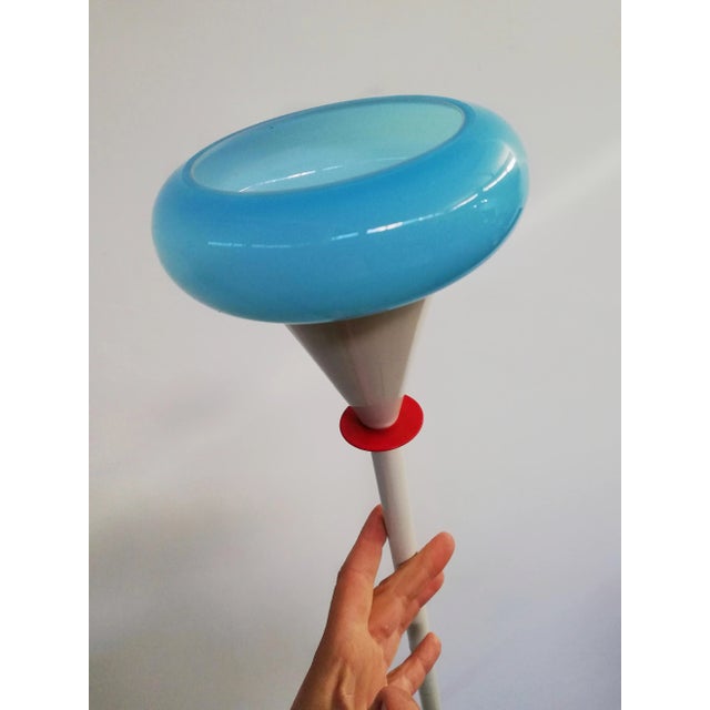 A floor lamp of the Italian postmodern trend in vogue during the 1980s. Simple geometric shapes with bright colors and...