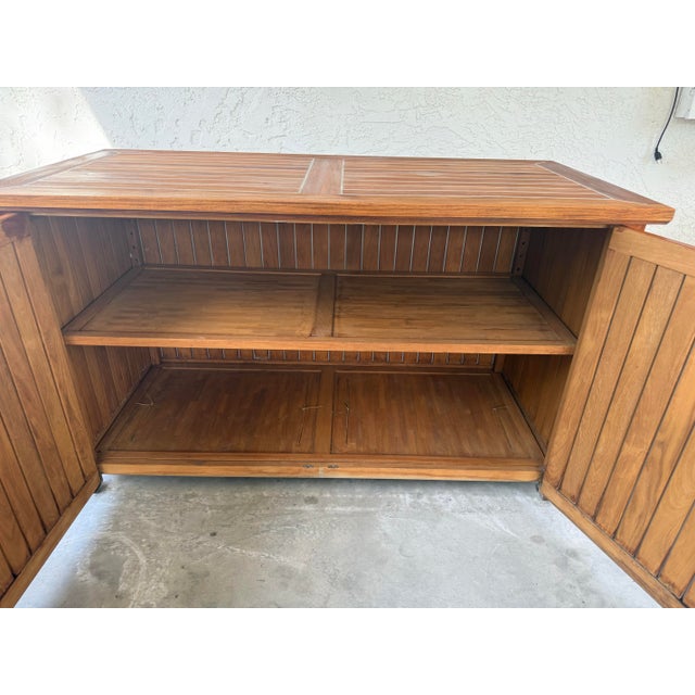 High-end Gloster teak sideboard outdoor storage unit. Crafted from premium, sustainably sourced teak, substantial storage...