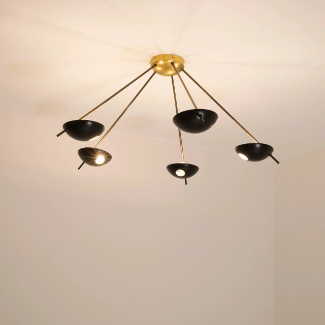 The Helios Penta Ceiling Light brings elegance to midcentury design through the inspiration of Italian design - inspired...
