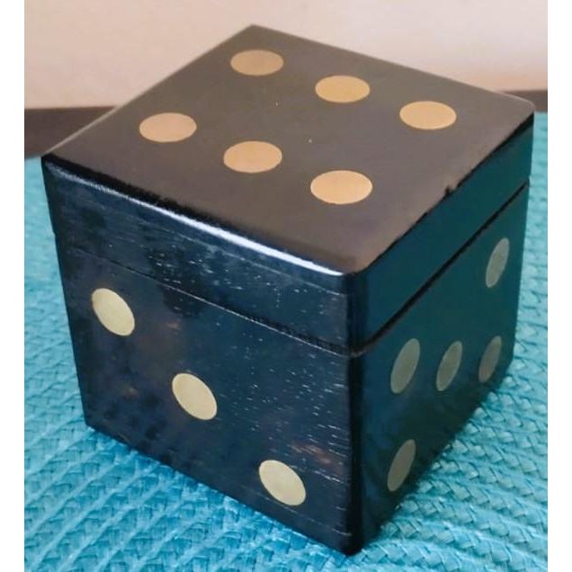 This captivating vintage dice set comprises eight handcrafted wooden dice stored in a cleverly designed matching cubic...