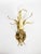 French decorative wall light dating from the 1970s, crafted from gilt metal. The design features an expressive arrangement...