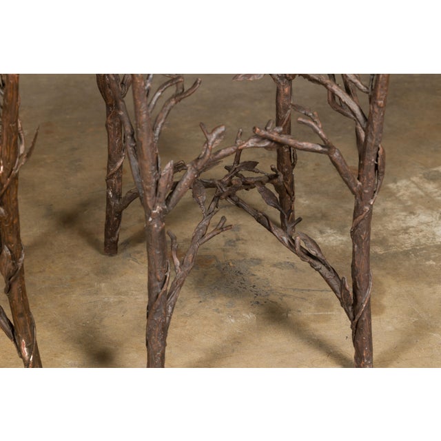 This pair of French iron twig drinks table bases from the mid-20th century exemplifies a whimsical yet elegant approach to...