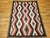 Presenting a striking piece of Native American hand crafted heritage with this large vintage Navajo rug, handwoven in the...