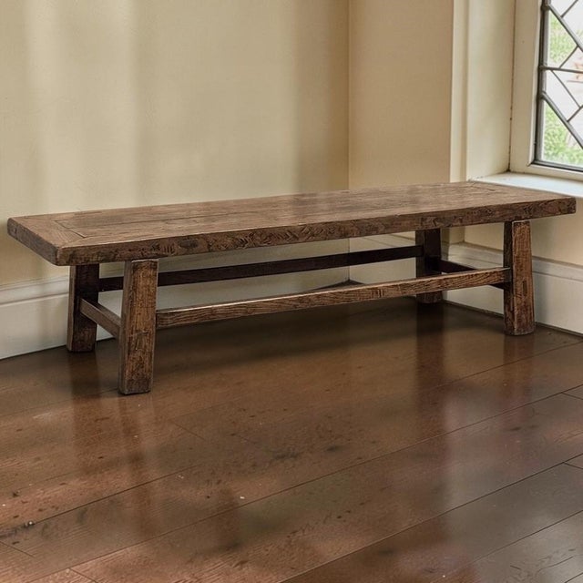 Handcrafted in France during the 18th century, this rustic oak coffee table embodies the straightforward beauty and...