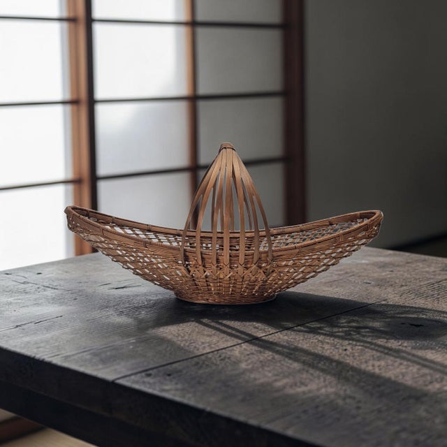 This exceptionally large, 21-inch sculptural gathering basket stands as a masterful testament to mid-century organic...