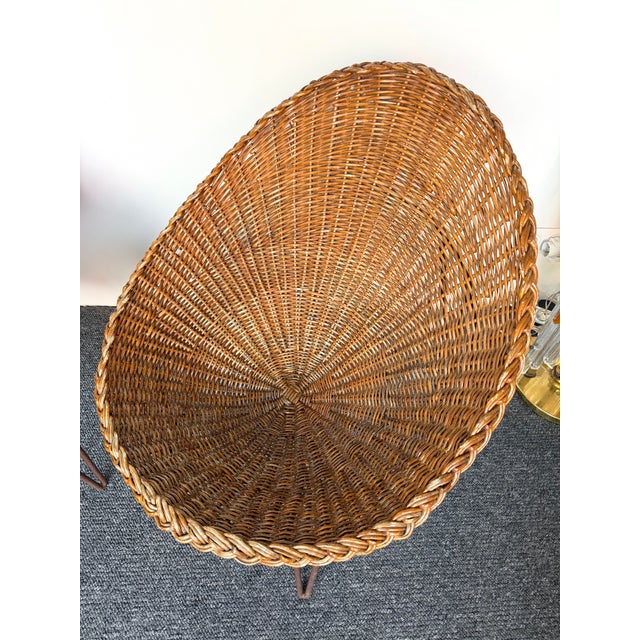 Mid-Century Modern french Rattan wicker bucket basket armchairs or slipper chairs, interesting compas metal feet four...