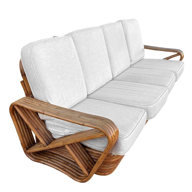 The Restored Rattan 5-Strand Square Pretzel 4-Seat Sofa offers spacious seating with a solid, durable base. Showcasing...