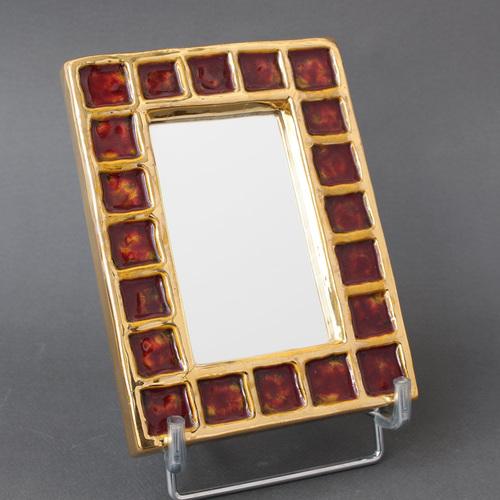 French vintage ceramic wall mirror by françois lembo (circa 1970s). A whimsically decorated, small rectangular wall mirror...