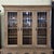 This English Late Light Oak 19th Century Carved Base and Glazed Top Bookcase is a beautiful piece with plenty of storage...