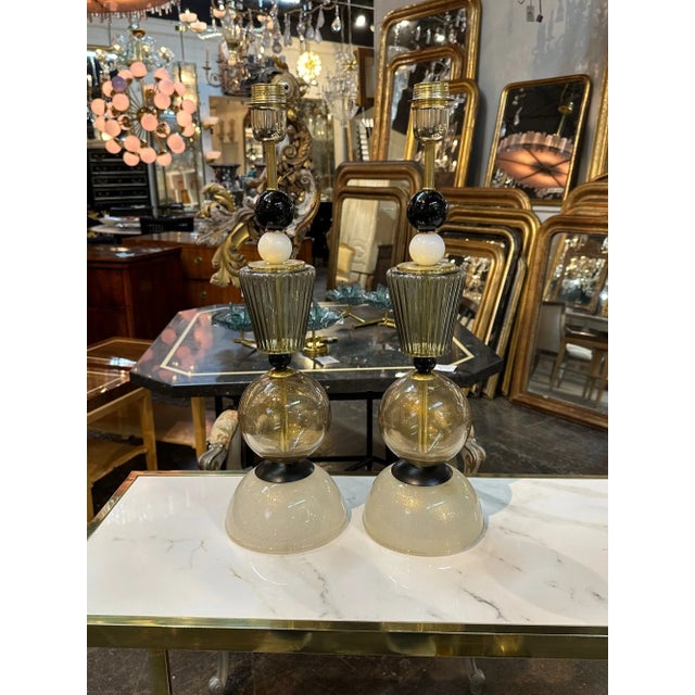 Pair of modern Murano glass black and gold component lamps. Circa 2000. Perfect for today's transitional designs!