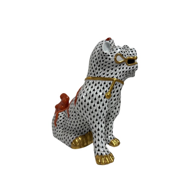 Herend porcelain Foo Dog, featuring black fishnet pattern with rust color and 24K gold accents.