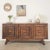 Substantial oak sideboard from France, 1940s. Carved wood square detail on cabinet doors and angular legs. Three doors...
