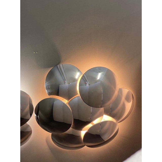Rare pair of large "Seven" wall lamps by Reggiani with seven convex discs, 1970s, Italy, original label This piece has an...