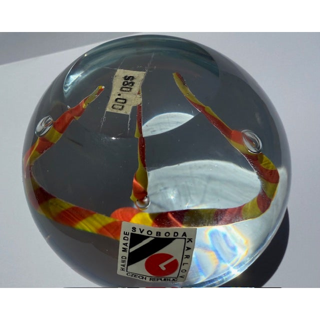 For sale is a 3" art glass crystal globe handmade by Karlov Svoboda. It features twisted orange and yellow strands with...