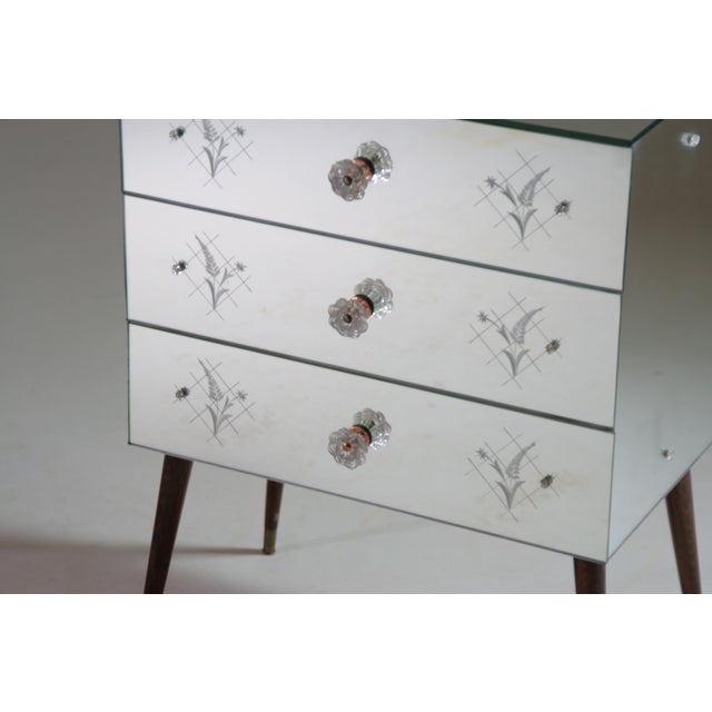 Add a touch of elegance and refinement to your home with this vintage 3-drawer mirrored chest. Its decorative mirrored...