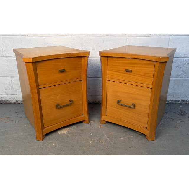 This pair of unique Mid-Century Modern nightstands brings timeless style and sculptural design to your bedroom or living...