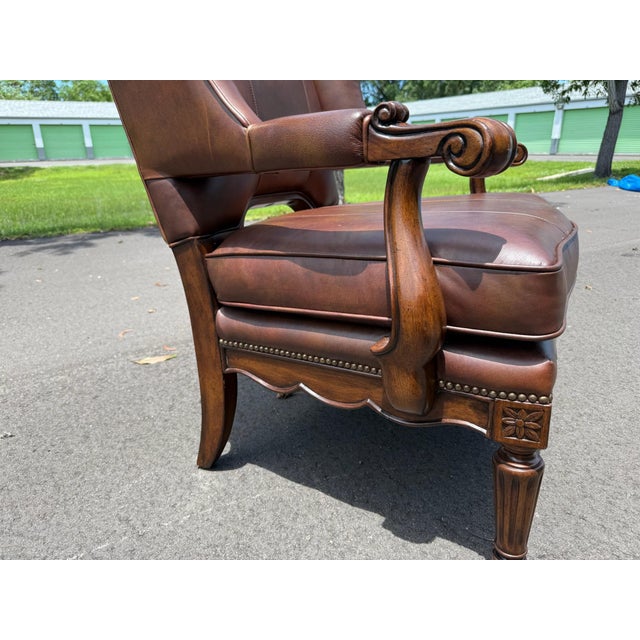 I believe this chair is Maitland Smith, regency collection given the leg carving detail and high quality production. The...