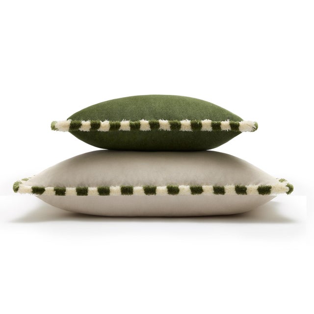A bold yet refined accent, this cushion is crafted in rich green velvet, enhanced by a distinctive striped fringe in green...