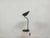 A characterful vintage desk lamp by bag turgi, dating from the 1940s. Its minimalist, functional design, featuring a...