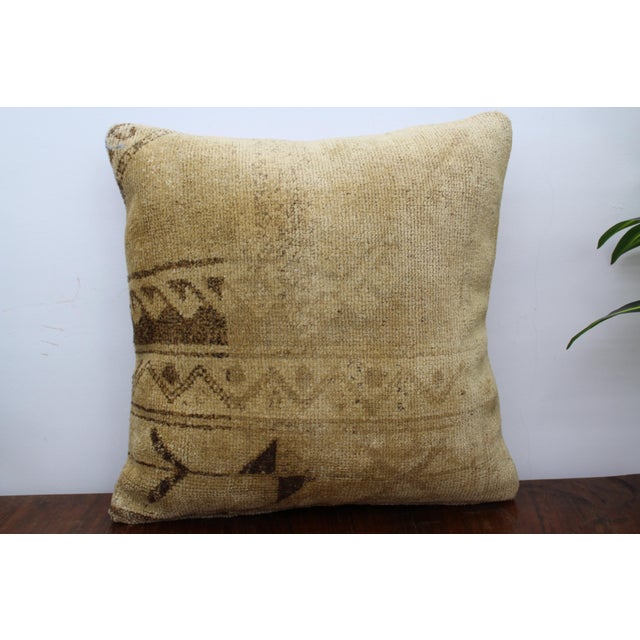This Turkish pillow cover is made from the highest quality antique rug in 100% wool on the front. The back is covered in...