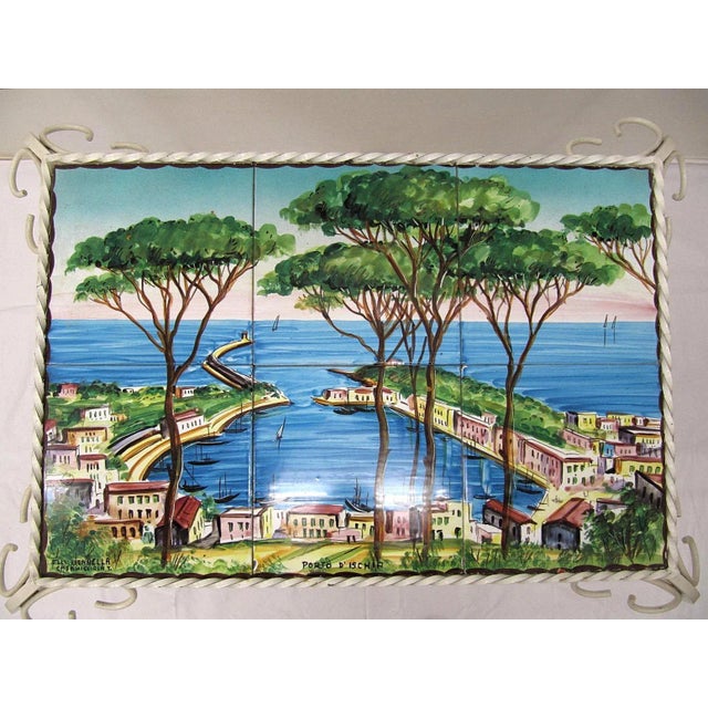 Side table in white painted wrought iron. The table top is made of 6 hand-painted tiles famous for its ceramics factory...