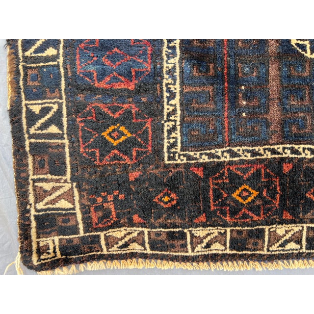 1930s Antique Afghan Baluchi Hand-Knotted Rug | Rare Low-Pile Tribal Wool Carpet in Dark Blue & Rust Tones Rug For Sale - Image 5 of 8