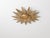 This sunburst ceiling light was made in the 1950s, reflecting the Mid-Century fascination with sun and starburst forms...