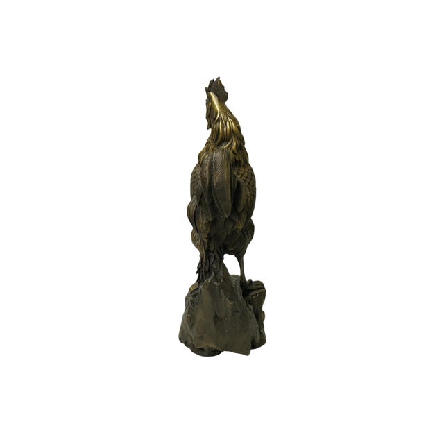 This striking bronze sculpture depicts a rooster in mid-crow, captured with an impressive sense of vitality and movement....