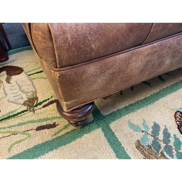 20 th century Thomasville tufted chesterfield large ottoman. Brown worn in leather. Ottoman is on castors for...