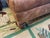 20 th century Thomasville tufted chesterfield large ottoman. Brown worn in leather. Ottoman is on castors for...