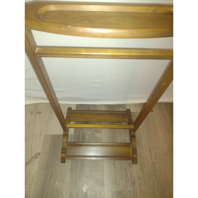 This is a Butler brand 973 wood Valet Stand. This item is in very good condition and very sturdy.