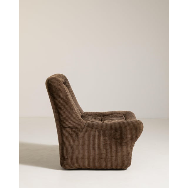 A sculptural mid-century lounge chair defined by its low profile and modular form, reflecting 1960s–70s experimentation...
