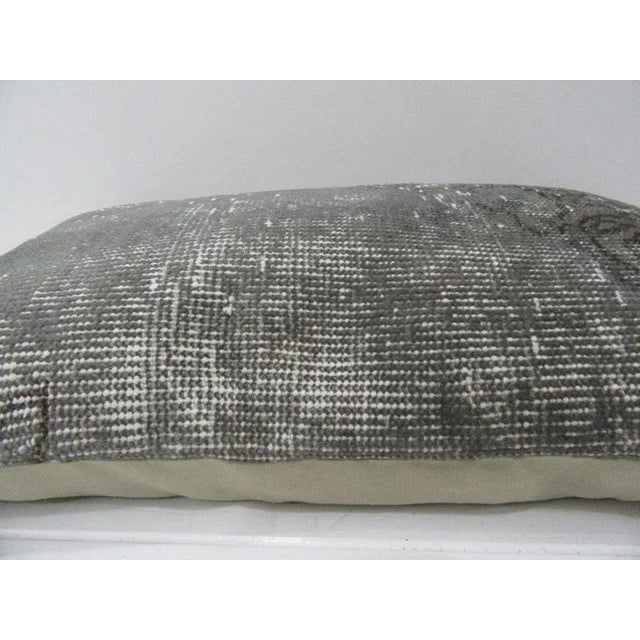 This is a pillow cover made from a vintage kilim rug. The piece was properly washed and ready to use. Pillow inserts not...